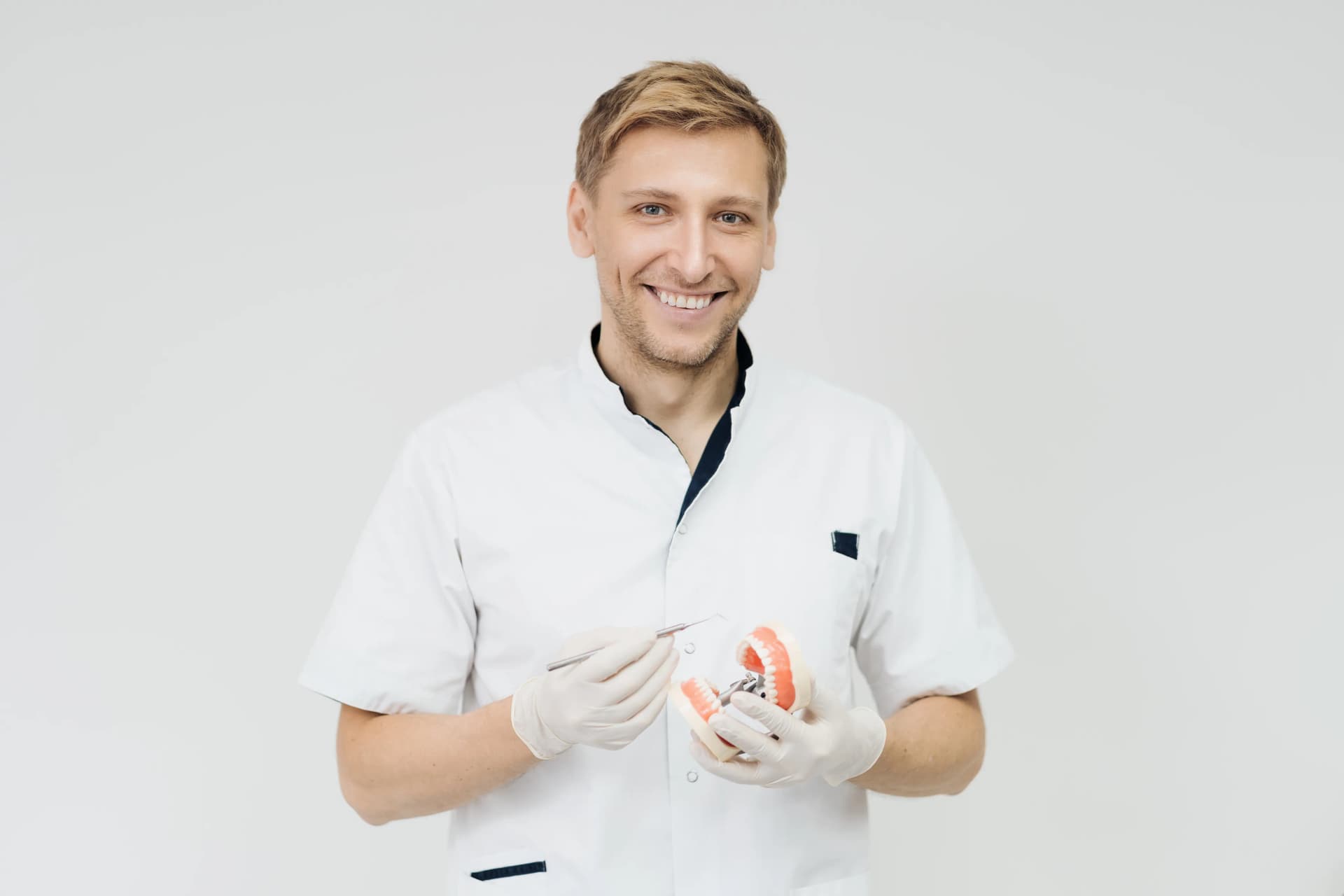 Dentist holding dental model